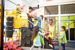 Kids playing, stacking bricks at interactive construction exhibit in science center