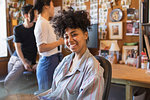 Portrait smiling, confident creative businesswoman in office