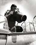 1940s ANONYMOUS MAN PHOTOGRAPHER WITH LARGE AERIAL CAMERA USED BY U.S. AIR FORCE FOR RECONNAISSANCE AND MAP MAKING