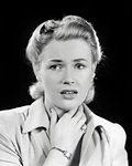 1940s BLONDE WOMAN HAND TO THROAT NECK LOOKING SICK OR PERHAPS SHOCKED