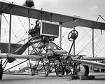 CIRCA 1911 CURTISS PUSHER MODEL D ENGINE AND PROPELLER ARE MOUNTED BEHIND THE PILOT RESTING ON A TRICYCLE WHEEL UNDERCARRIAGE