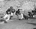 1930s LEATHER HELMET COLLEGE FOOTBALL TEAMS PLAYING MAN RUNNING CARRYING THE BALL