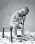 1920s 1930s TIRED BABY TODDLER WEARING COTTON CLOTH DIAPER FALLEN ASLEEP SITTING IN CHAIR