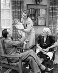 1930s THREE GENERATION FAMILY SITTING TOGETHER IN LIVING ROOM BABY MOTHER FATHER GRANDMOTHER