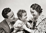 1940s PORTRAIT SMILING MOTHER AND FATHER HOLDING INFANT SON