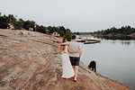 Couple walking with pet dog, Algonquin Park, Canada