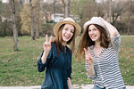 Happy girlfriends in park