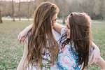 Happy girlfriends in park