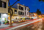 View of cafes and car trail lights in old town at dusk, Funchal, Madeira, Portugal, Europe