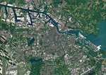 Color satellite image of Amsterdam, capital city of Netherlands. The River Amstel flows through the city. Image collected on May 26, 2017 by Sentinel-2 satellites.