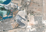 Color satellite image of Abu Dhabi International Airport, United Arab Emirates. The amusement park Ferrari World Abu Dhabi is on Yas Island, at center left on the image. Image collected on September 21, 2017 by Sentinel-2 satellites.