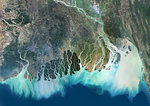 Satellite image of the Ganges River Delta, Bangladesh, India. Also known as the Brahmaputra Delta, it empties into the Bay of Bengal. Kolkata sits within the lower Ganges Delta along the Hooghly River (at west on the image). Image collected on March 16, 2017 by Sentinel-2 satellites.