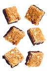 Protein cereal energy mini bars nuts and chocolate for breakfast on white background