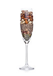 Glass with healthy organic nuts almonds and cashew and pumpkin and sunflower seeds on white background