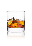 Elegant glass of whiskey with ice cubes on white background with reflection