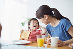 Japanese mother and kid having breakfast