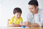 Japanese father and kid playing