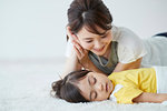 Japanese mother with sleeping kid