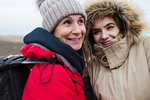 Mother and daughter in warm clothing