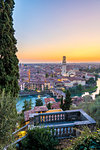 High angle view of Ponte Pietra (Stone Bridge) and Verona cathedral at sunset. Verona, Veneto, Italy