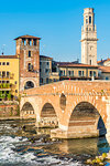 Ponte Pietra (Stone Bridge) and Verona old town at sunrise. Verona, Veneto, Italy