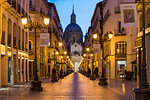 Calle Alfonso and the Cathedral of Our Lady of the Pillar at dusk. Zaragoza, Aragon, Spain, Europe