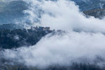 Clouds wrap Motta alpine village, Spluga valley, Campodolcino, Sondrio province, Lombardy, Italy, Europe