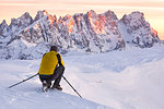 A photographer in action on the top of Col Margherita, Dolomites, Falcade, Belluno province, Veneto, Italy