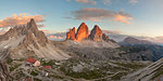 Sunset on Paternkofel and Drei Zinnen with Locatelli-Innerkofler refuge, Dolomites, Dobbiaco, South Tyrol, Bolzano, Italy