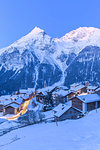 Dusk at the village of Latsch with Piz Ela in the background. Bergun, Albula Valley, District of Prattigau/Davos, Canton of Graubünden, Switzerland, Europe.