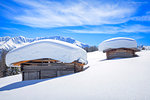 Typical alpine huts after a heavy snowfall. Wiesner Alp, Davos Wiesen, Landwasser Valley, Albula Valley, District of Prattigau/Davos, Canton of Graubünden, Switzerland, Europe.