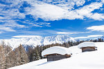 Typical alpine huts after a heavy snowfall. Wiesner Alp, Davos Wiesen, Landwasser Valley, Albula Valley, District of Prattigau/Davos, Canton of Graubünden, Switzerland, Europe.