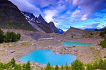 Clouds leave the place to the clear sky above Lake Miage. Miage Lake, Veny Valley, Courmayeur, Aosta Valley, Italy, Europe