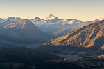 Last rays of light on Mt Aspiring seen from Roys Peak lookout. Wanaka, Queenstown Lakes district, Otago region, South Island, New Zealand.