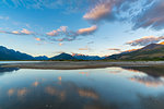 Clouds in the sky above Lake Wakatipu and mountains at sunset. Glenorchy, Queenstown Lakes district, Otago region, South Island, New Zealand.