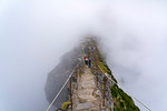 People descending the steps on the trail at Pico do Areeiro. Funchal, Madeira region, Portugal.