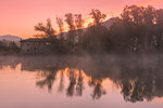 Reflections on Adda river at dawn, Lecco Province, Lombardy, Italy