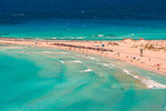 People on the narrow stretch of white sand which divides Simos beach, Elafonissos, Laconia Region, Peloponnese, Greece