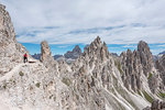 Misurina, Cadini mountains, Dolomites, province of Belluno, Veneto, Italy. A mountaineer on the mountain trail "Durissini"