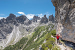 Misurina, Cadini mountains, Dolomites, province of Belluno, Veneto, Italy. A mountaineer on the mountain trail "Bonacossa"