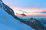 Aerial view of helicopter in flight on Piz Morteratsch, Bernina Group, Valmalenco, Lombardy, border of Italy and Switzerland
