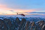 Aerial view of helicopter in flight on Pizzi Gemelli toward Piz Bernina, Valmalenco, Lombardy, border of Italy and Switzerland