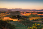 Podere Belvedere, San Quirico d'Orcia, Siena province, Tuscany, Italy. Sunrise over the farmhouse and the hills.