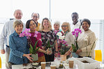 Portrait smiling active seniors enjoying flower arranging class