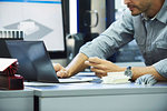 Engineer using laptop in office