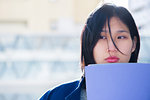 Serious woman holding file