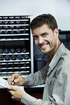 Portrait of engineer holding clipboard