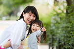 Japanese mother and daughter at a city park