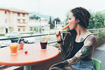 Woman eating ice cream in corridor