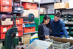 Colleagues working on delivery and packaging in warehouse